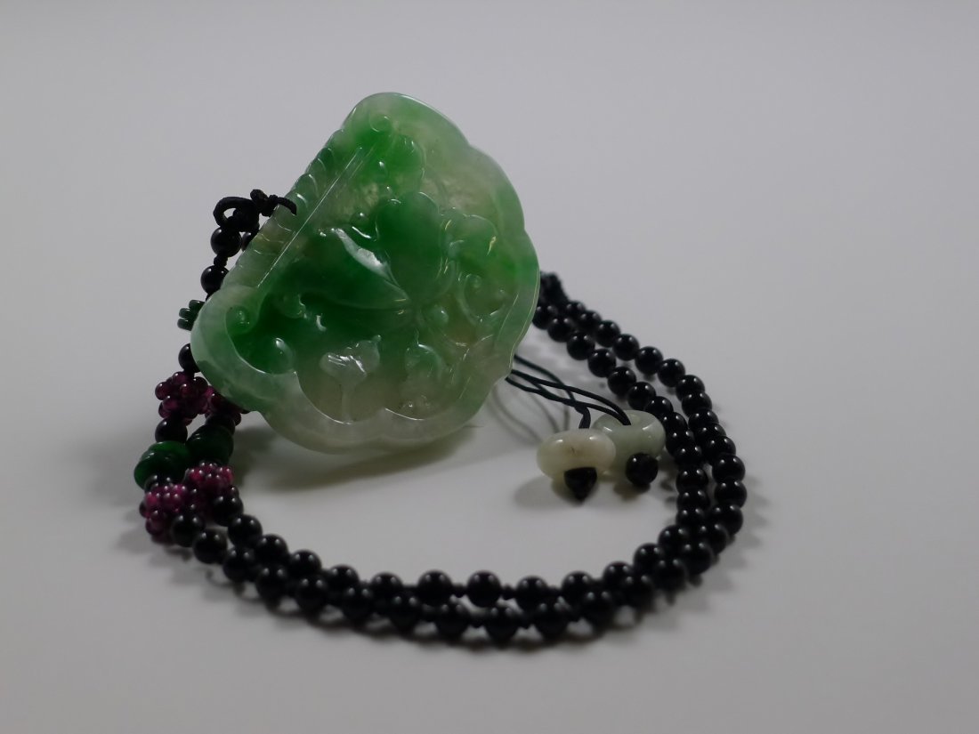 Chinese Jadeite wishful pendant: Chinese Jadeite wishful pendant, carved bat and money, means in front of blessing (福在眼前), 2 x 1.5", Necklace is obsidian 16" long.