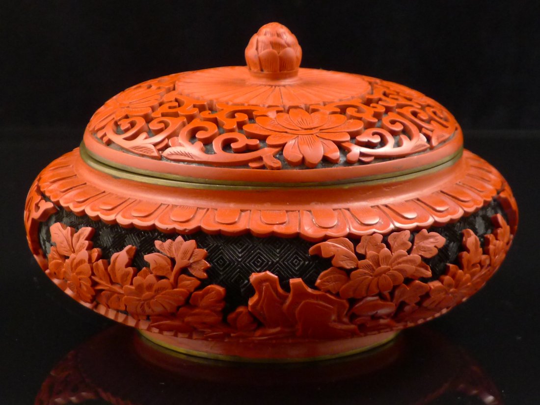 Vintage Cinnabar Lacquerware Jar: Vintage, carved, red cinnabar lacquer and cloisonne jar. This beautiful lidded bowl has detailed dimensional carving on its red and black lacquer surface. The lid has a carved cinnabar lacquer finial.