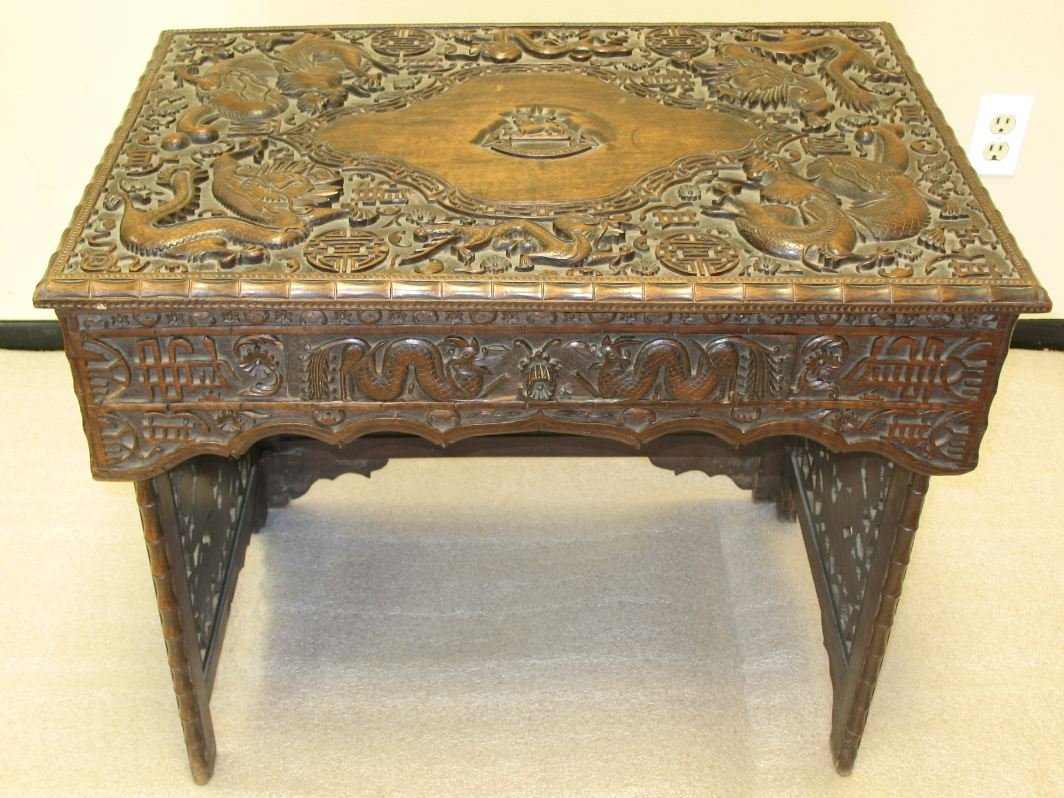 18th century Chinese style hardwood table: 18th century Chinese style hardwood table, it can fold and have carving with dragon, bat, lion and flower, there is little wear and break mark. Size: 29.5 x 19.5 x 24.5".