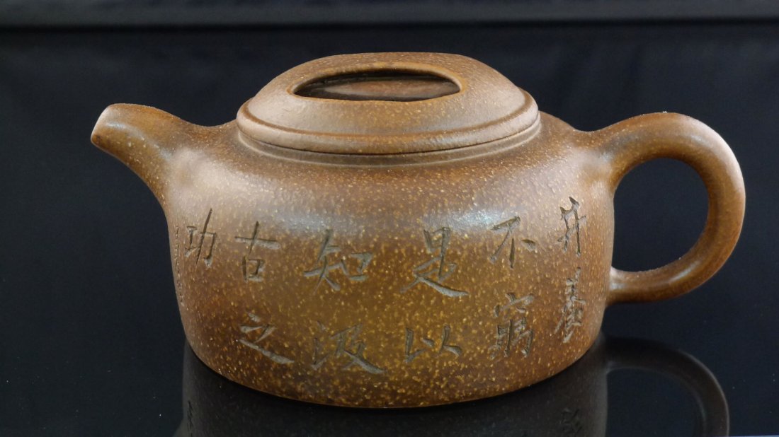 Chinese Yixing Clay Teapot: Chinese Yixing Clay Teapot, and a seal mark on the bottom, 2.8" x 6.5" x 4.5".