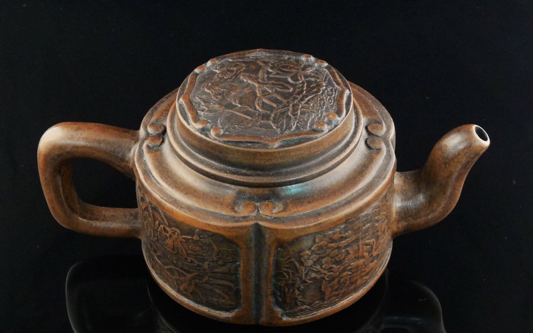 Chinese Yixing Clay Teapot: Chinese Yixing Clay Teapot with animal & flower design, and a seal mark on the bottom, 3.5" x 7.5" x 4.5".