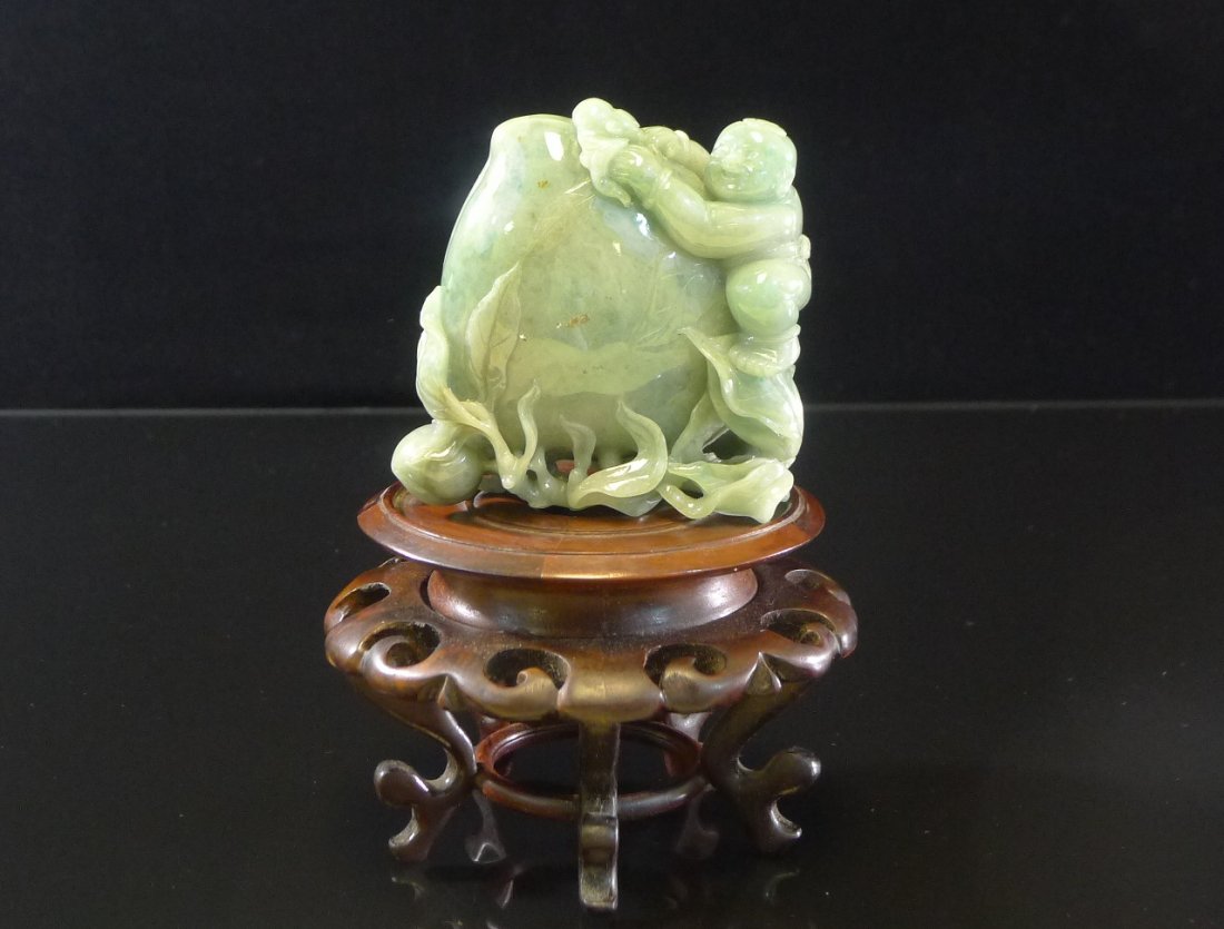 Chinese Jadeite Decoration: Chinese Jadeite Decoration, carved with kid, peach and bats, 3" x 3" x1". (The base is only for exhibition using).