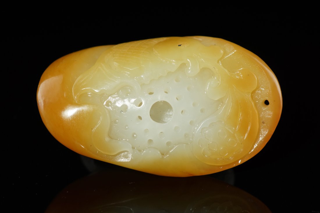 Chinese Xinjiang Nephrite Seed Material Pendant: Chinese Xinjiang Nephrite Seed Material Pendant, carved with fish and lotus design, symbol surplus and peace every year, size: 5.5cm x 3.3cm x 2cm, weight: 49.67g.