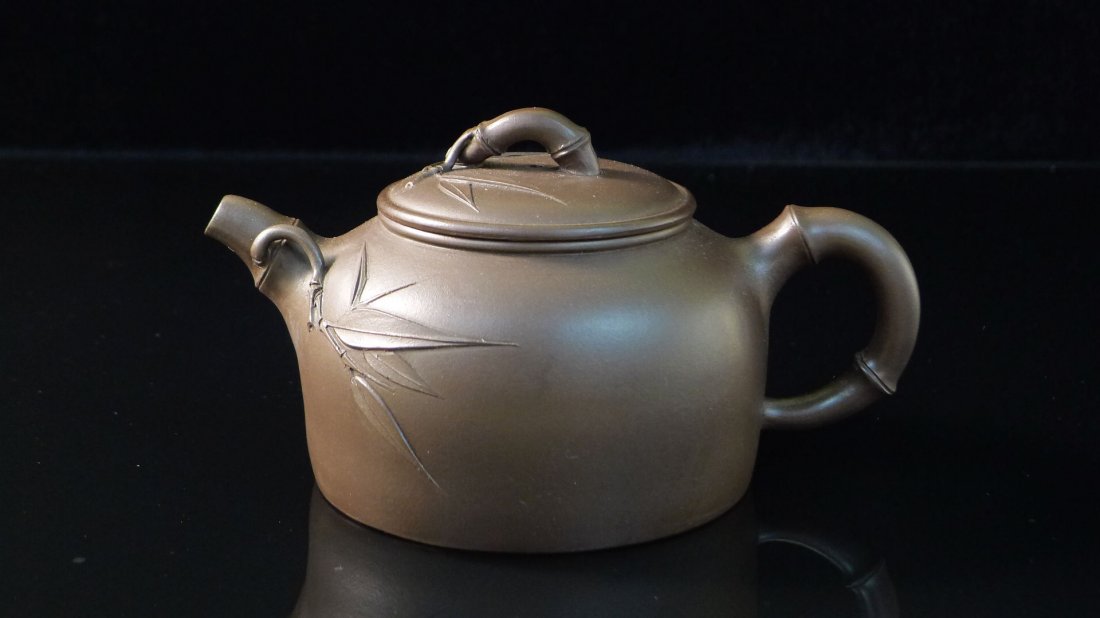 Chinese Yixing Clay Teapot: Chinese Yixing Clay Teapot with bamboo design, and a seal mark on the bottom, 3.5" x 6.25" x 3.75".