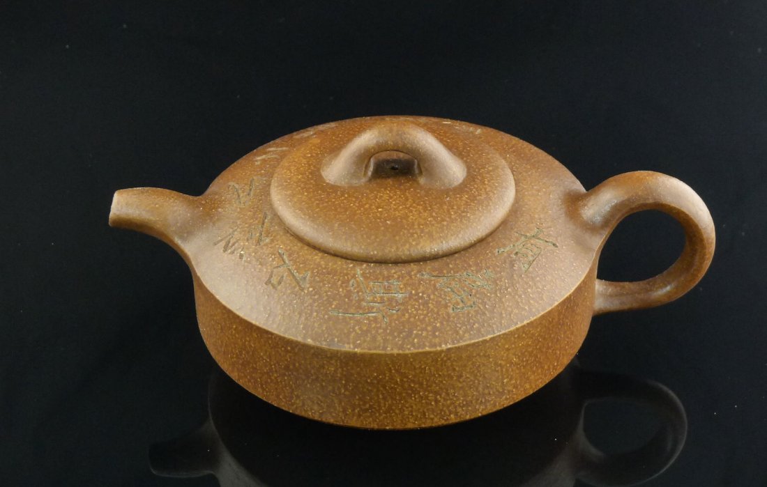 Chinese Yixing Clay Teapot: Chinese Yixing Clay Teapot, and a seal mark on the bottom, 3.25" x 7" x 5".