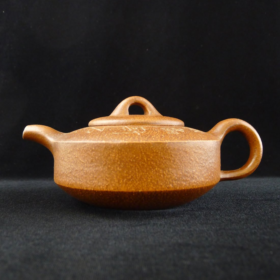 CHINESE YIXING CLAY TEAPOT: Chinese Yixing Clay Teapot, and a seal mark on the bottom, 3.25" x 7" x 5".