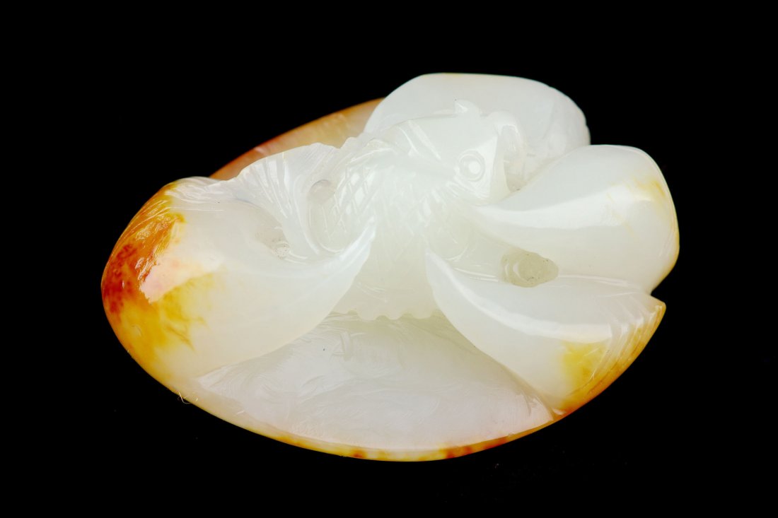 CHINESE WHITE JADE CARVED PENDANT: Chinese white jade carved pendant, seed material with fish design, size: 1.98 x 1.38 x 1.04", weight: 54.26 g.