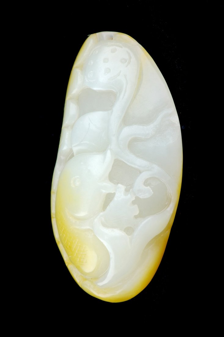 CHINESE WHITE JADE CARVED PENDANT: Chinese white jade carved pendant, seed material with fish, money and lotus design, size: 2.63 x 1.38 x 0.79", weight: 63.81 g.