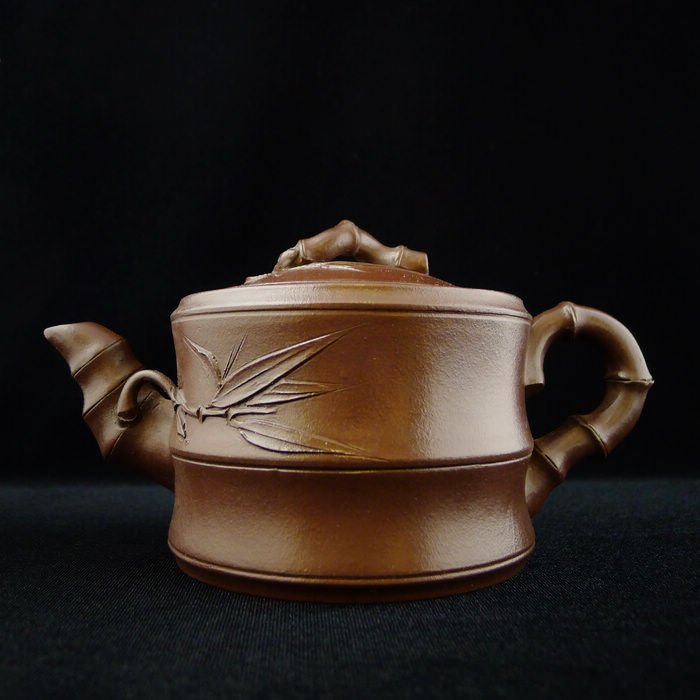CHINESE YIXING CLAY TEAPOT: Chinese Yixing Clay Teapot with bamboo design, and a seal mark on the bottom, 3.5" x 7" x 4".