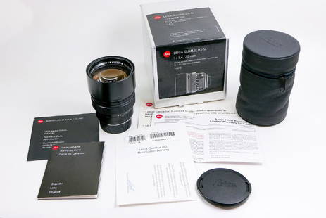 75mm Summilux-M f1,4 Germany: 75mm Summilux-M f1,4 Germany Nr. 3953017 complete in box wth warranty cards, instruction booklet, test certificate, leather fitted case and caps. Condition: Near Mint