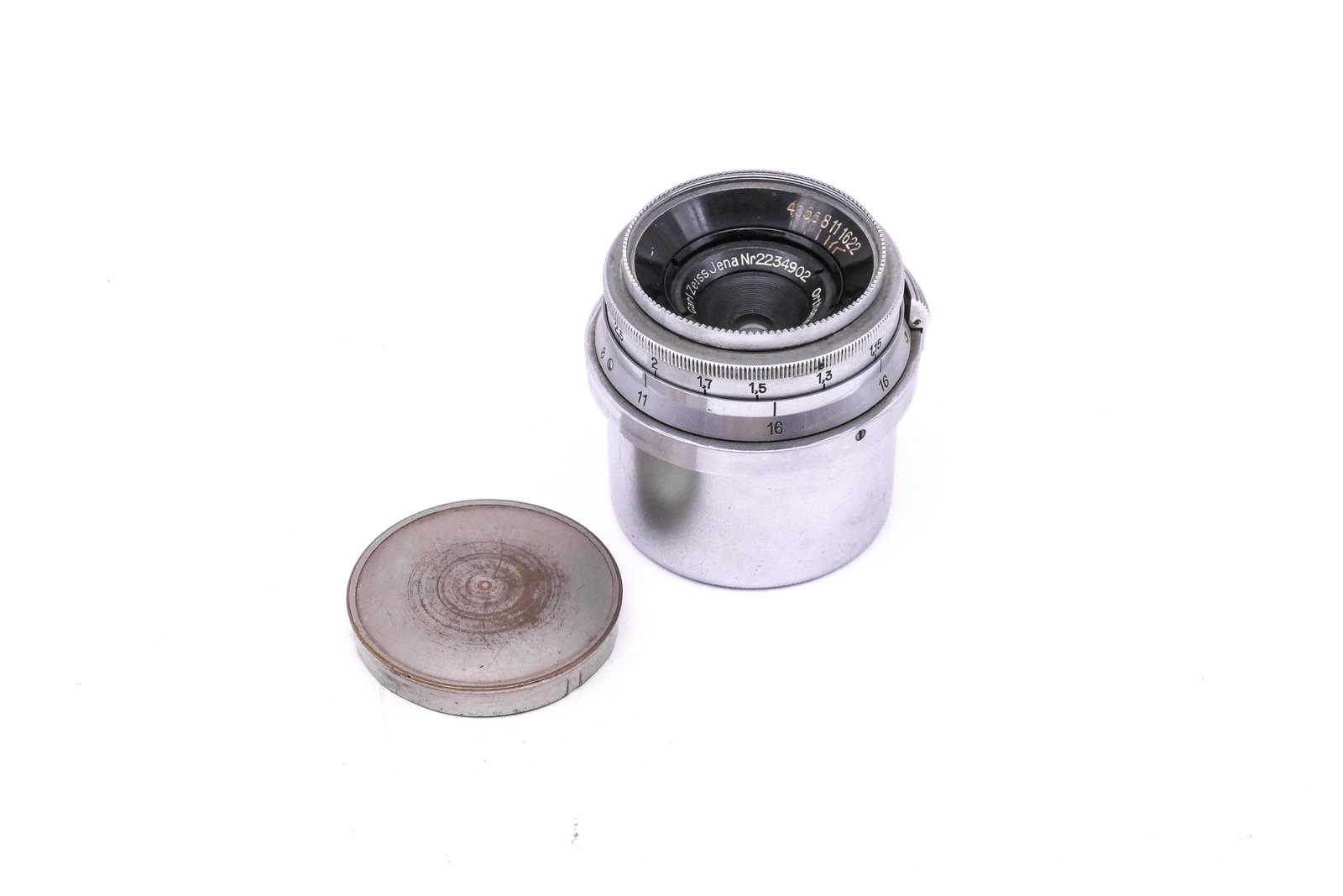 Zeiss 35mm Orthometar f4,5: Zeiss 35mm Orthometar f4,5 Nr. 2234902. A rare uncoated lens with original caps. Hazy optics. Condition: Excellent +