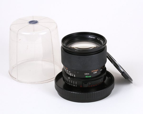 110mm Planar-FE f2 Nr. 6076521 with caps.: 110mm Planar-FE f2 Nr. 6076521 with caps and container. This lens has a scratch on an inner element.