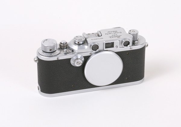 Leica IIIb Nr. 348913 with body cap.: Leica IIIb Nr. 348913 with body cap, slight depression near rewind knob.