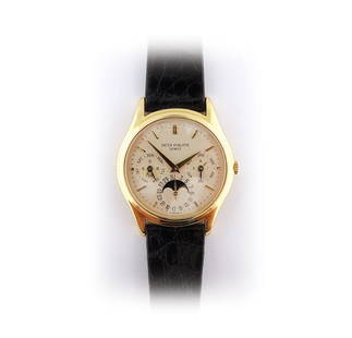 Patek Philippe, Perpetual Calendar.: Patek Philippe ref. 3940-J, Genève, no. 770758. Self-winding, 18K yellow gold wristwatch with perpetual calendar, moon phases, 24 hour indication, leap year indication and an 18K yellow gold Patek Ph