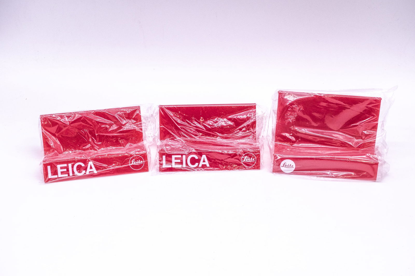 Three Leica camera stands in red plastic (1 of 8)