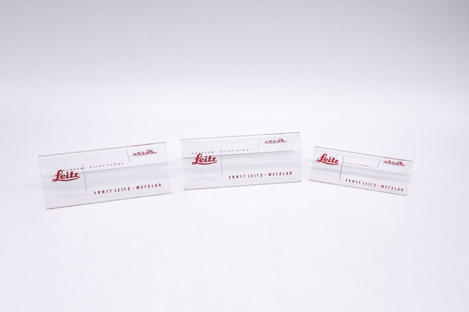 Three clear plastic “Leitz" table stands, in two sizes (1 of 4)