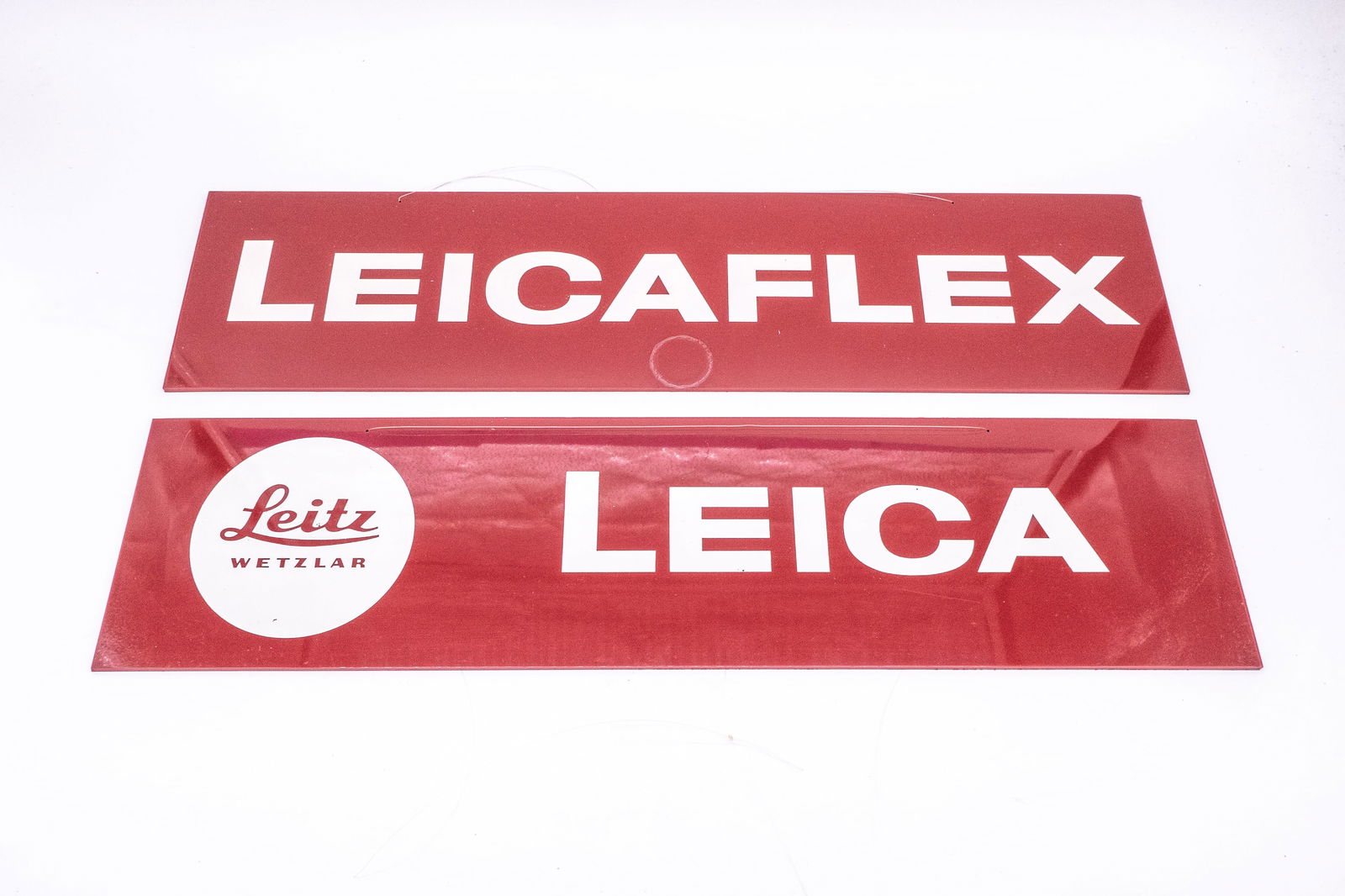 Two red plastic display placards (1 of 10)