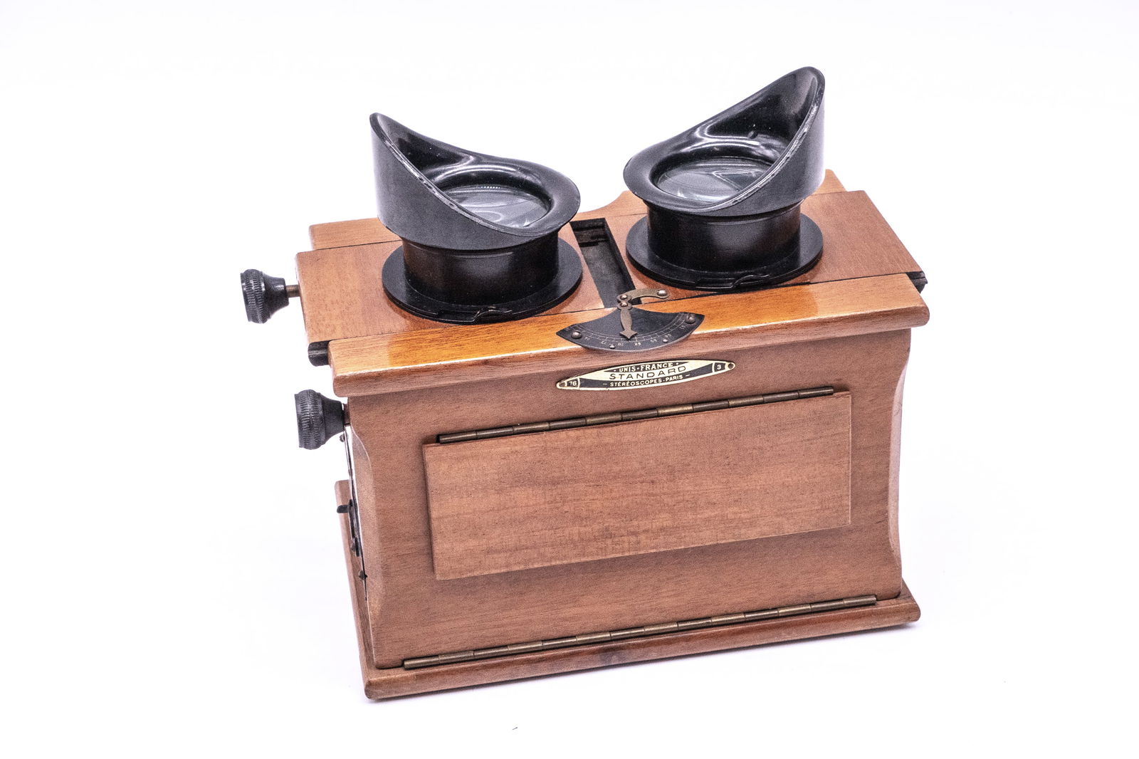 Unis-France Standard 6x13 Stereoscope: Unis-France Standard 6x13 Stereoscope. Made in the 1930s, this popular hardwood hand-held viewer features extendable eyepieces, a focusing mechanism and interocular adjustment. Marked “Photo-Plait P