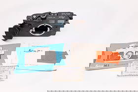 Leica M2 Nr. 948879, in black paint finish: Leica M2 Nr. 948879 Button Rewind, in black paint finish. Made in 1958, this black paint Leica M2 camera is working with the Leitz factory “Y” seal in place. A military number has been hand-en