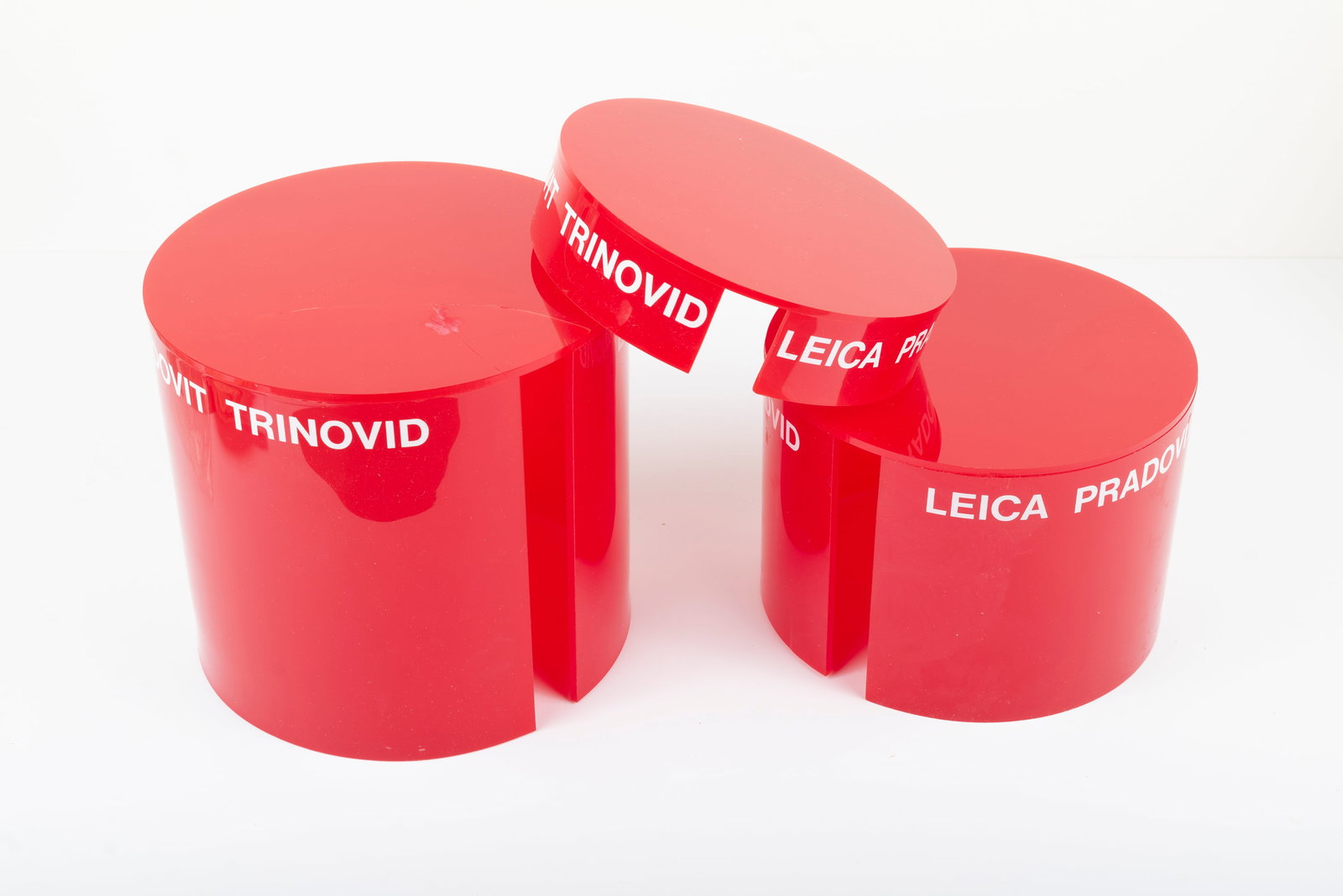 Three nesting red plastic display columns - 2