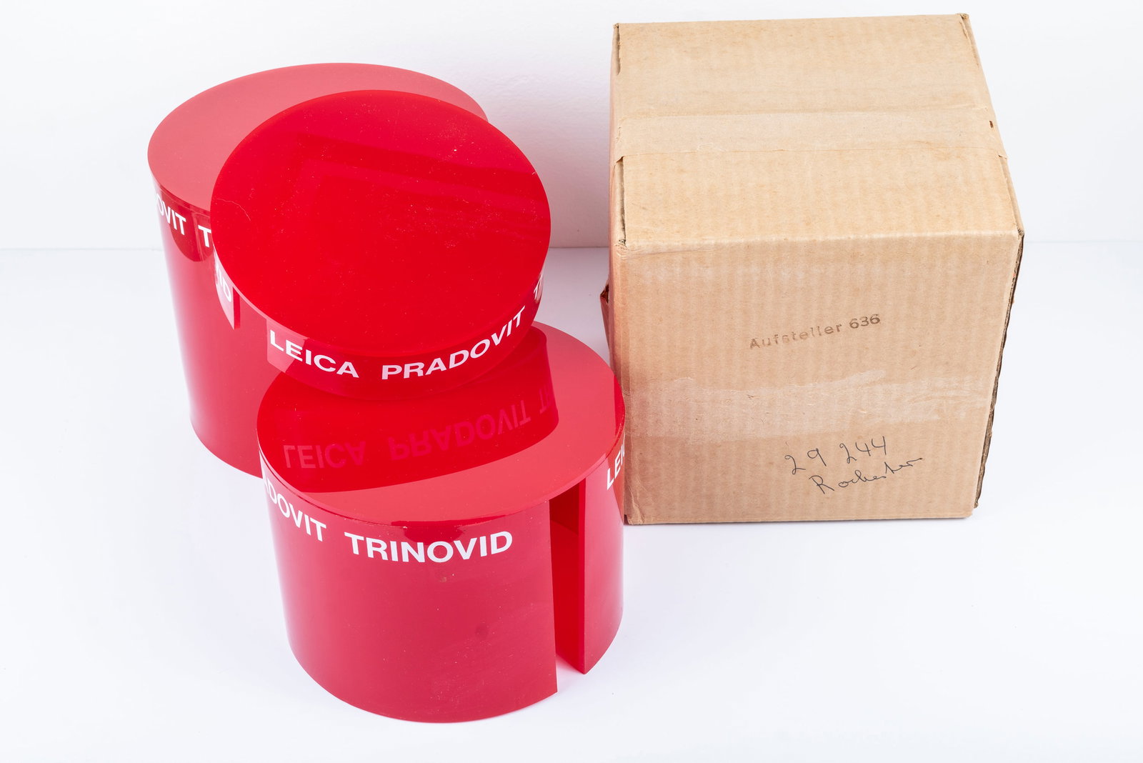 Three nesting red plastic display columns - 4