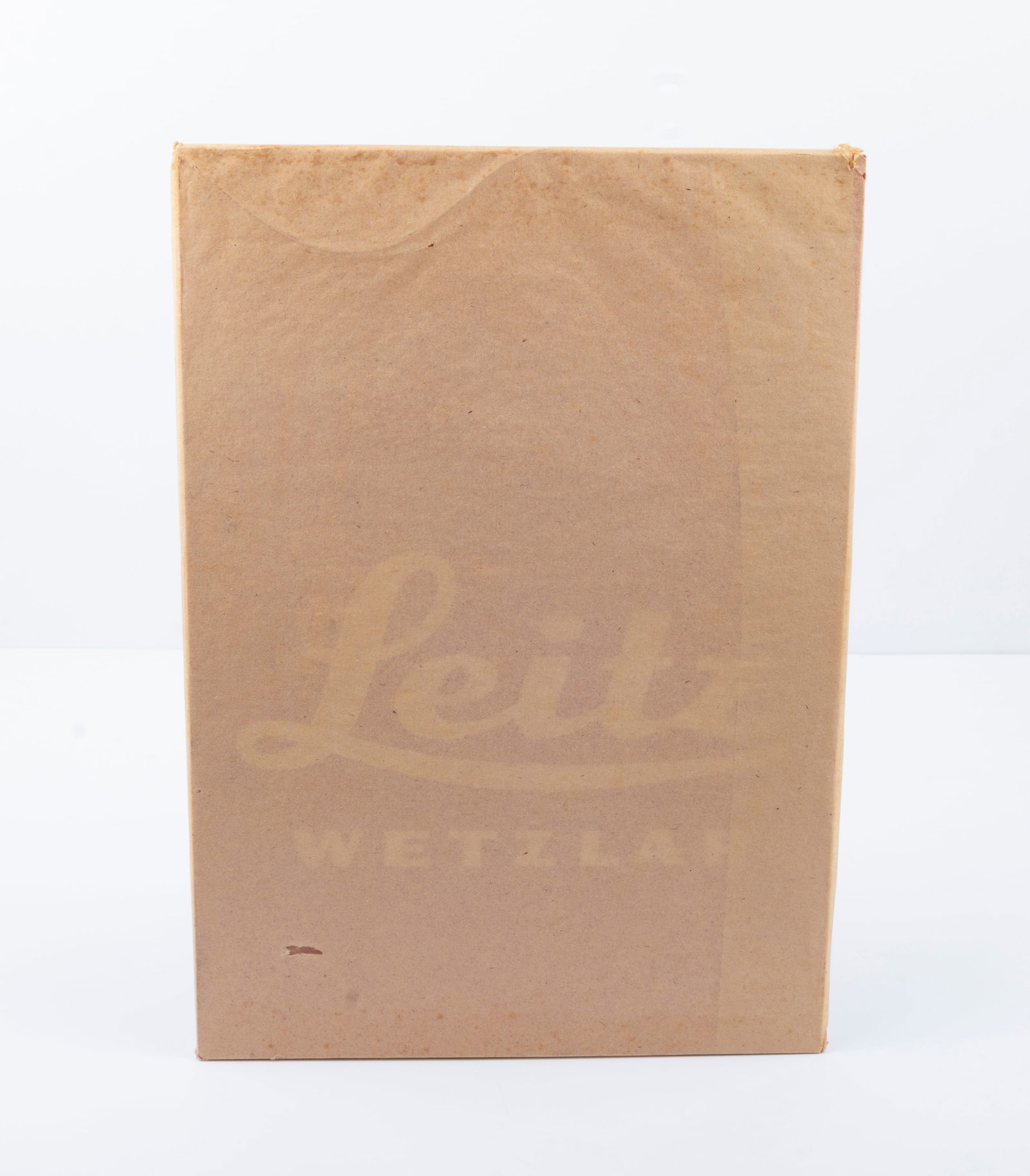 "Leitz Wetzlar" plastic dealer sign: "Leitz Wetzlar" plastic dealer sign, measuring approximately 11 1/2" by 8" and still wrapped in brown paper. Condition: Mint