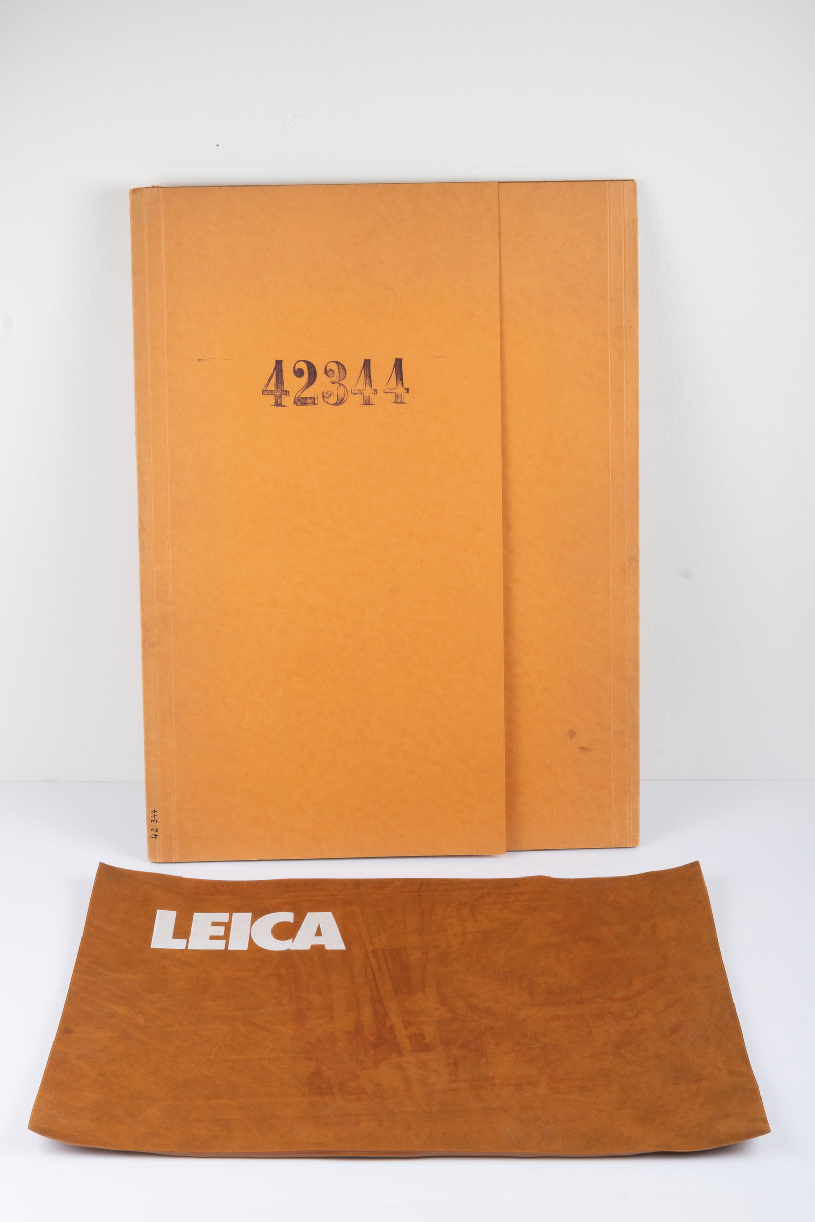 Leica R4 cutouts: Leica R4 cutouts for display in their original envelope, and a brown Leica counter mat, measuring approximately 12" by 16"Condition: Excellent + overall