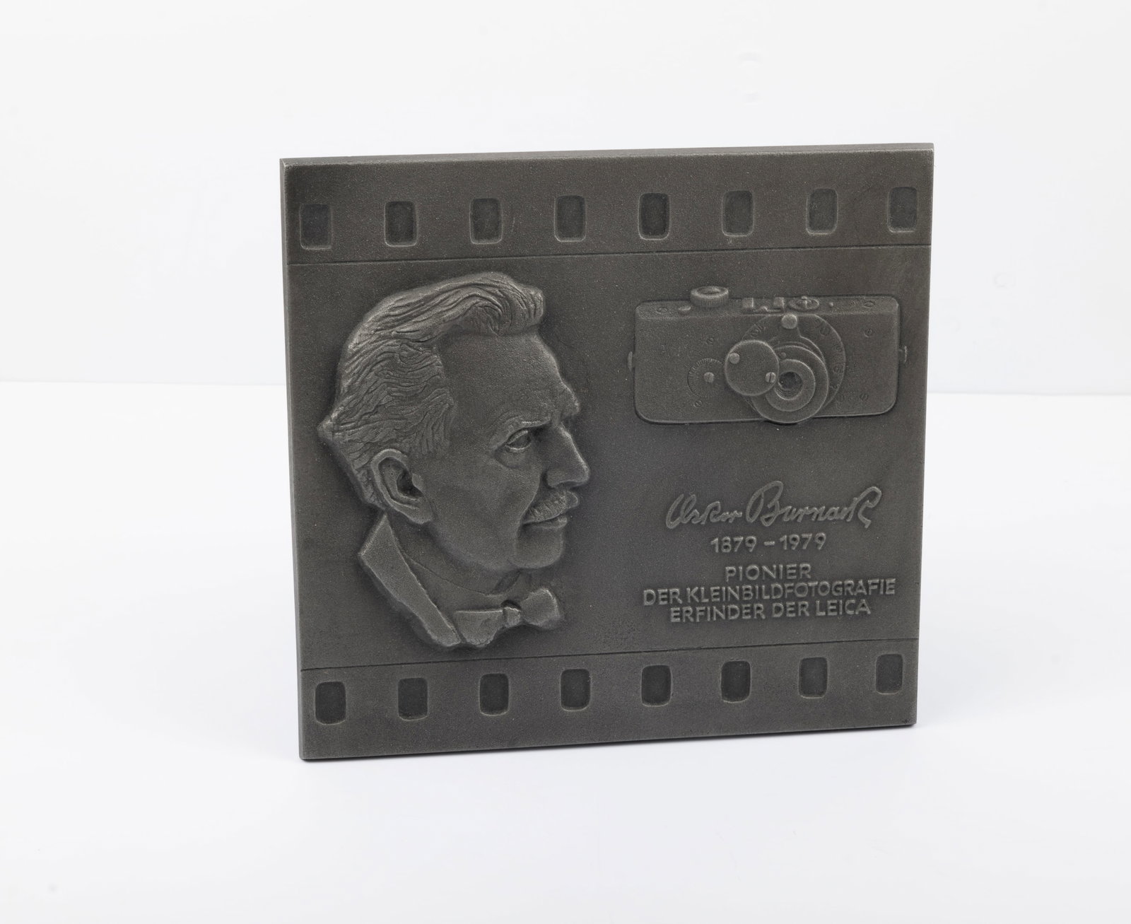 Oskar Barnack 1879-1979 Pioneer Plaque: Oskar Barnack 1879-1979 Pioneer Plaque, measuring 7 3/8 inches by 7 inches and is 3/16 inches thick. A must-have for Leica collectors.Condition: Near Mint