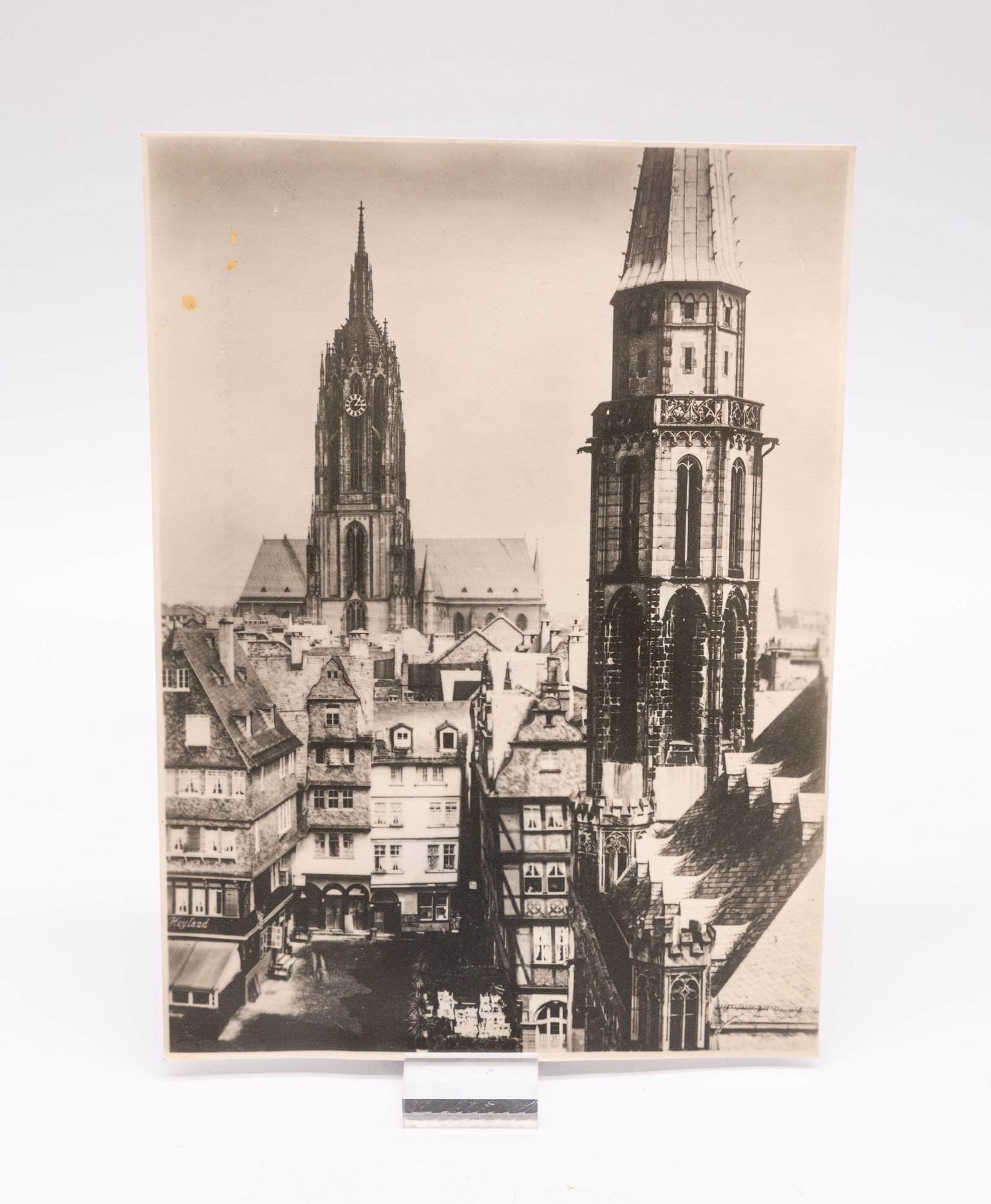 Dr. Wolff & Tritschler OHG print: Dr. Wolff & Tritschler OHG print, dating from the late 1940s. Measuring 6 1/2-inches by 9-inches. This postwar image was made of the "Alstadt" (old town) in Frankfurt, Germany. The image is stamped