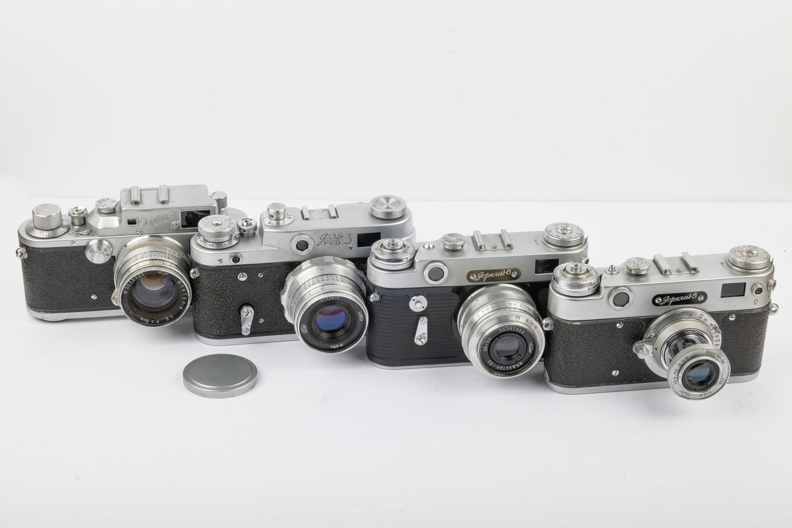 Four Russian-made rangefinder cameras: Four Russian-made rangefinder cameras with standard lenses:Krasnogorsk Zorki 3 Nr. 5511875, FED-3 Nr. 3233759 (with 52mm lens), Zorki-5 Nr. 39036233, and Zorki-6 Nr. 650043364. Condition: Excellent + 