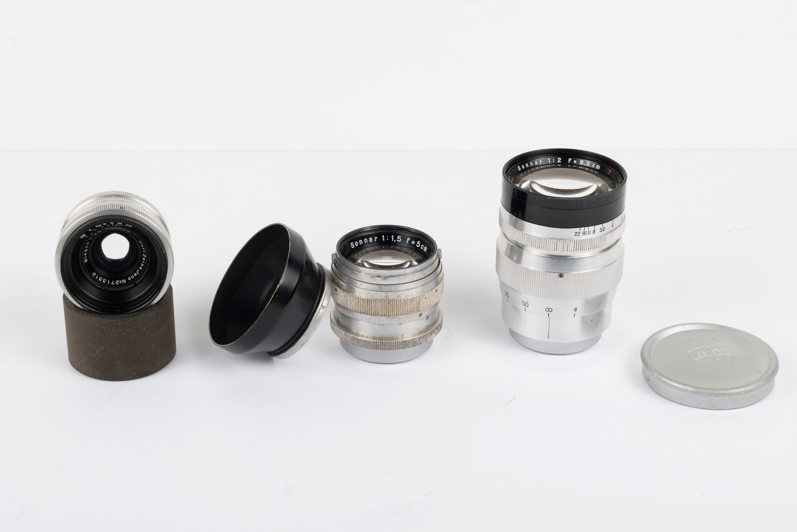 Three uncommon Zeiss Jena lenses: Three uncommon Zeiss Jena lenses in original Leica screw mount: 35mm Biogon f2,8 T Nr. 2713312, 50mm Sonnar f1,5 T Nr. 2709197 with lens shade, and 85mm Sonnar f2 T Nr. 2766833 in a heavy and bright c