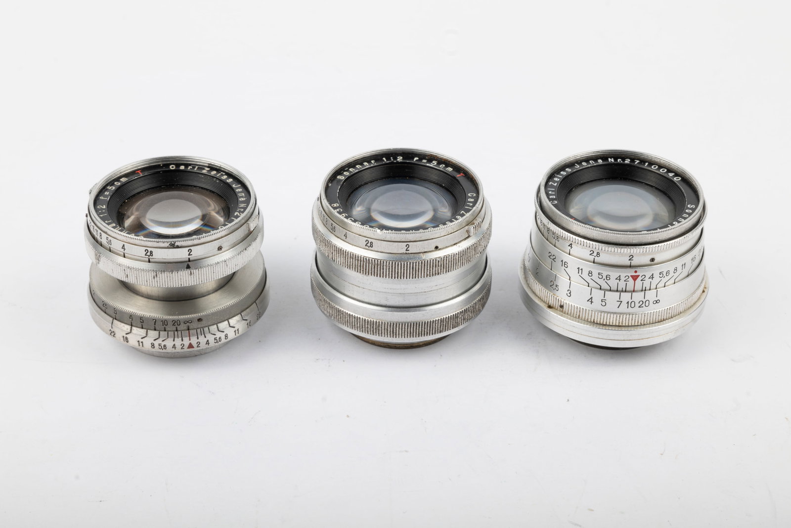 Three examples of the Zeiss Jena 50mm Sonnar f2: Three examples of the Zeiss Jena 50mm Sonnar f2 lens in Leica screw mount:50mm Sonnar f2 T Collapsible Nr. 2710470, 50mm Sonnar f2 T Nr. 2685938 "rigid" and 50mm Sonnar f2 T Nr. 2710040 with infinity 