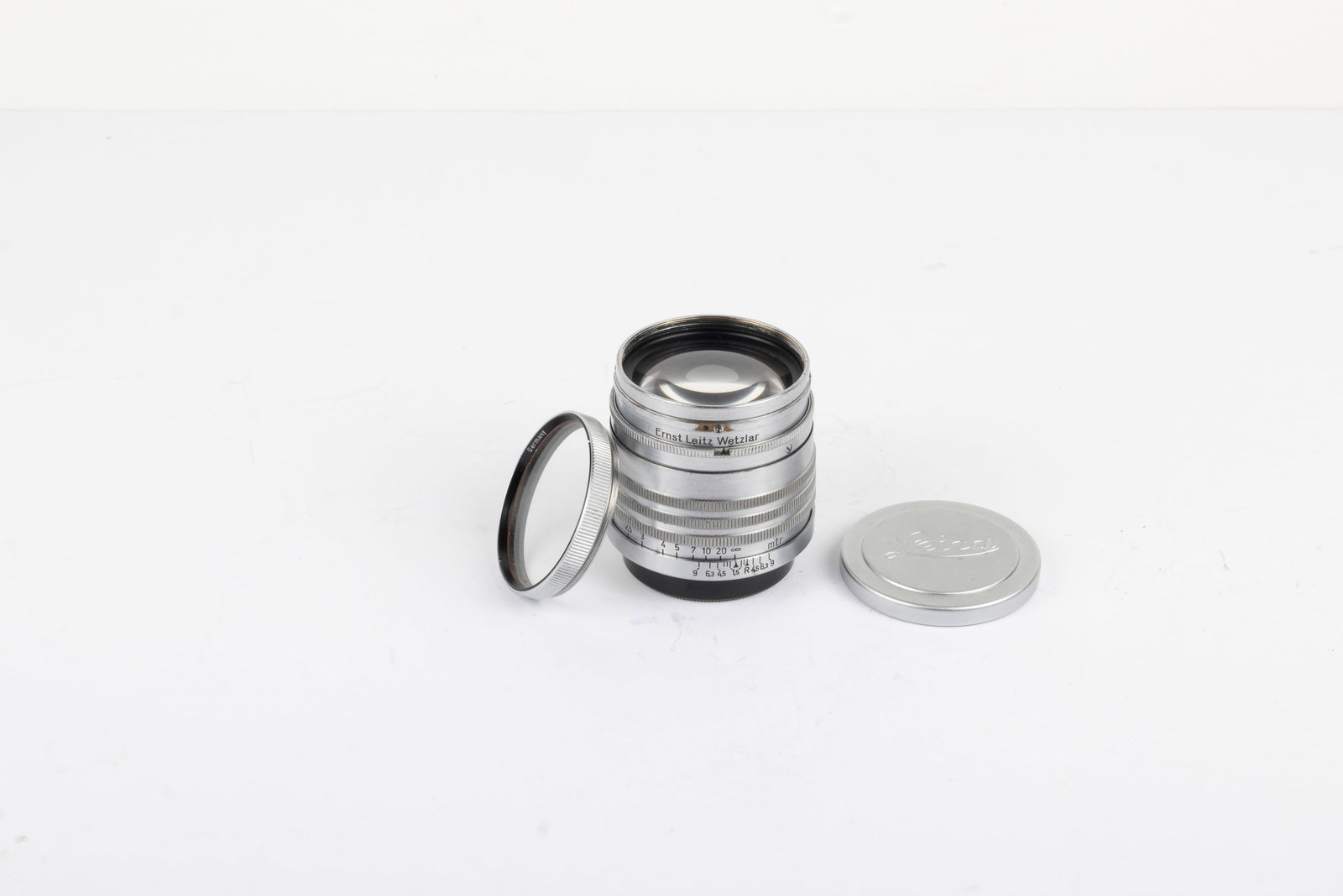 50mm Xenon f1,5 Nr. 491354: 50mm Xenon f1,5 Nr. 491354 with clear, unmarked filter simply engraved, "Germany." Made in 1939, the final year of production, this lens is the 646th from the last Xenon made. Also included are the