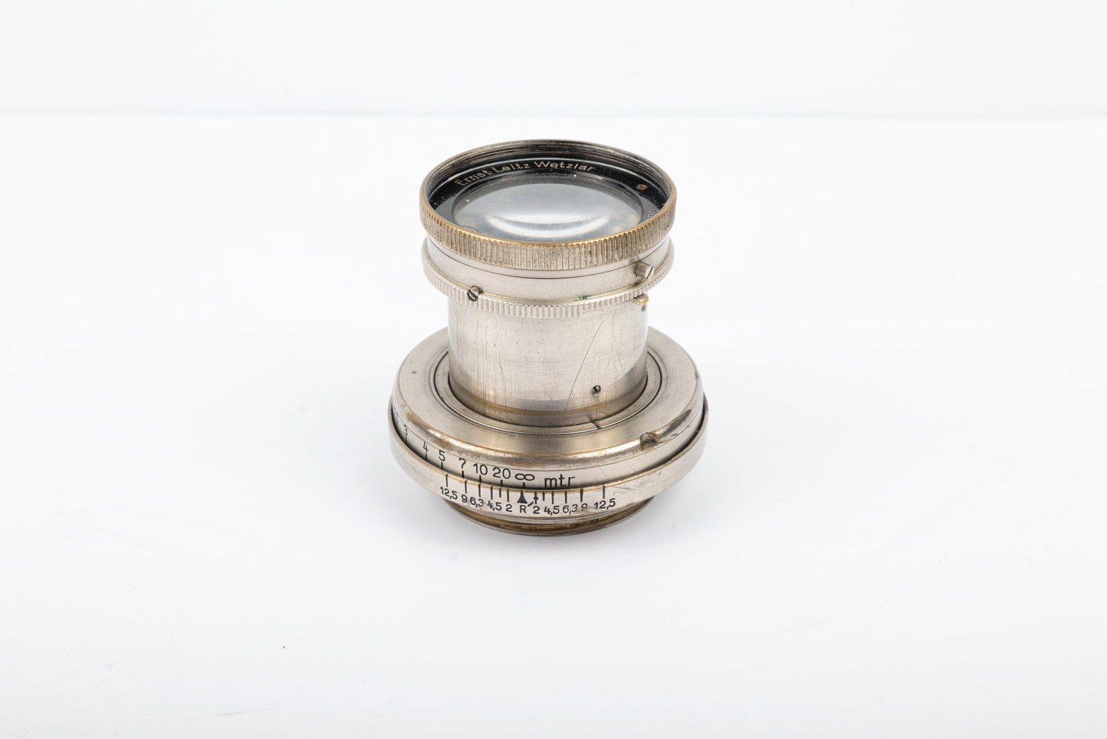 50mm Summar f2 Nr. 256719: 50mm Summar f2 Nr. 256719 in nickel finish. Some of the metal near the mount has been reworked and the optics show cleaning marks, but the lens is otherwise working. Condition: Very Good