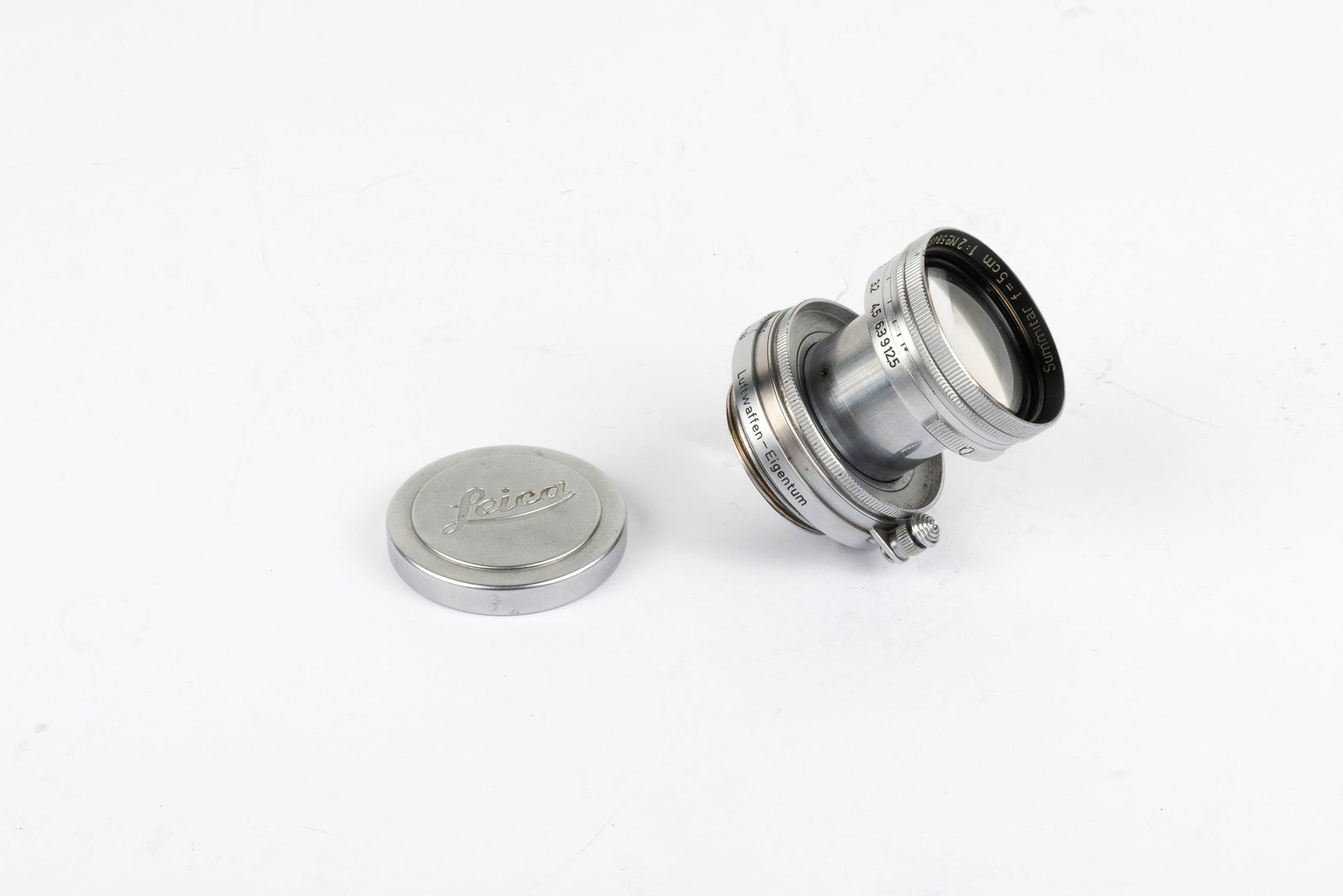 50mm Summitar f2 Luftwaffen-Eigentum Nr. 584890: 50mm Summitar f2 Luftwaffen-Eigentum Nr. 584890. Made in 1944, this lens was specifically delivered to the German Air Force and engraved on the lens mount. Condition: Excellent ++