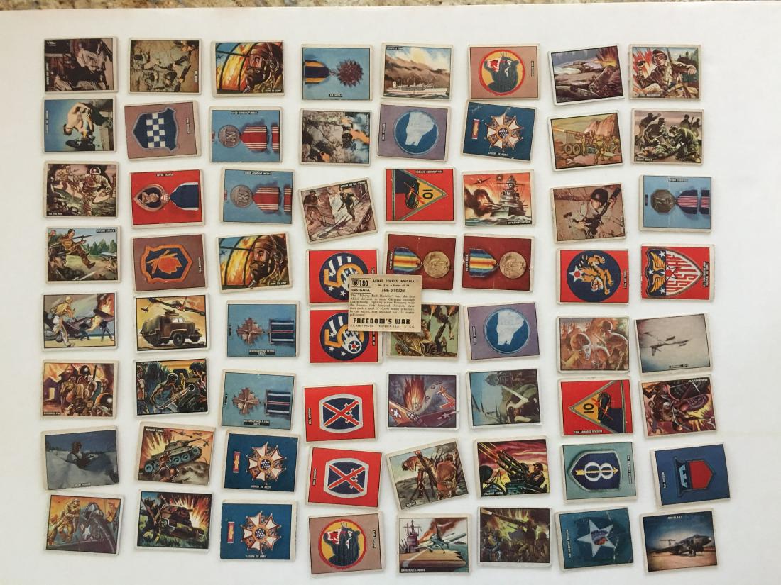 FREEDOM'S WAR CARD SET: The 1950 Topps Freedoms War set consists of 203 cards. This set contain s 64 various cards. It features Korean War scenes as well as depictions of combat training, military insignia, weapons, medals, 
