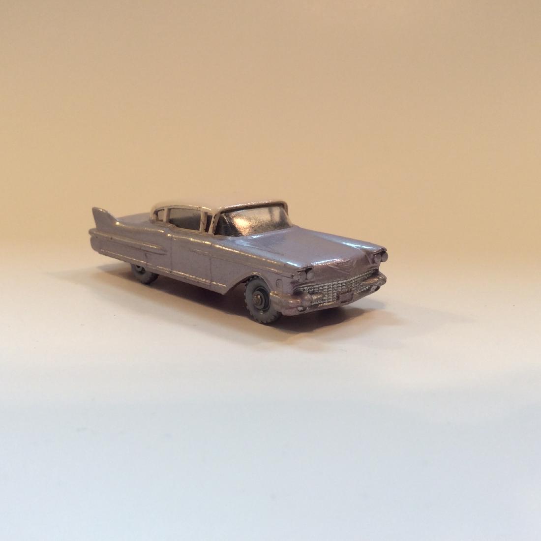 Matchbox Lesney #27 Cadillac Sixty Special SPW 1960: Matchbox Lesney #27 Cadillac Sixty Special SPW 1960 with Grey wheels, Made in 1960 in England. Lavender Body, Pink Roof, Silver Front Grille, Red Taillights, Clear Windows, Metal Tow Hook, Maroon Meta