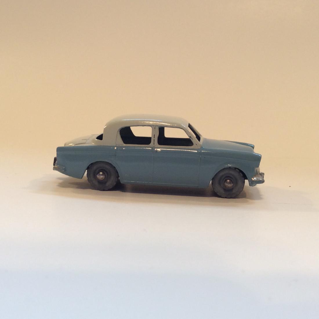 Early Lesney #43 Hillman Minx Grey Wheels Car: Early Matchbox Lesney No.43 Hillman Minx Grey Wheels Car. 1958 Matchbox Hillman Minx #43-B. GW. Light blue body with cream colored roof and trunk. Red painted tail lights. Black base.