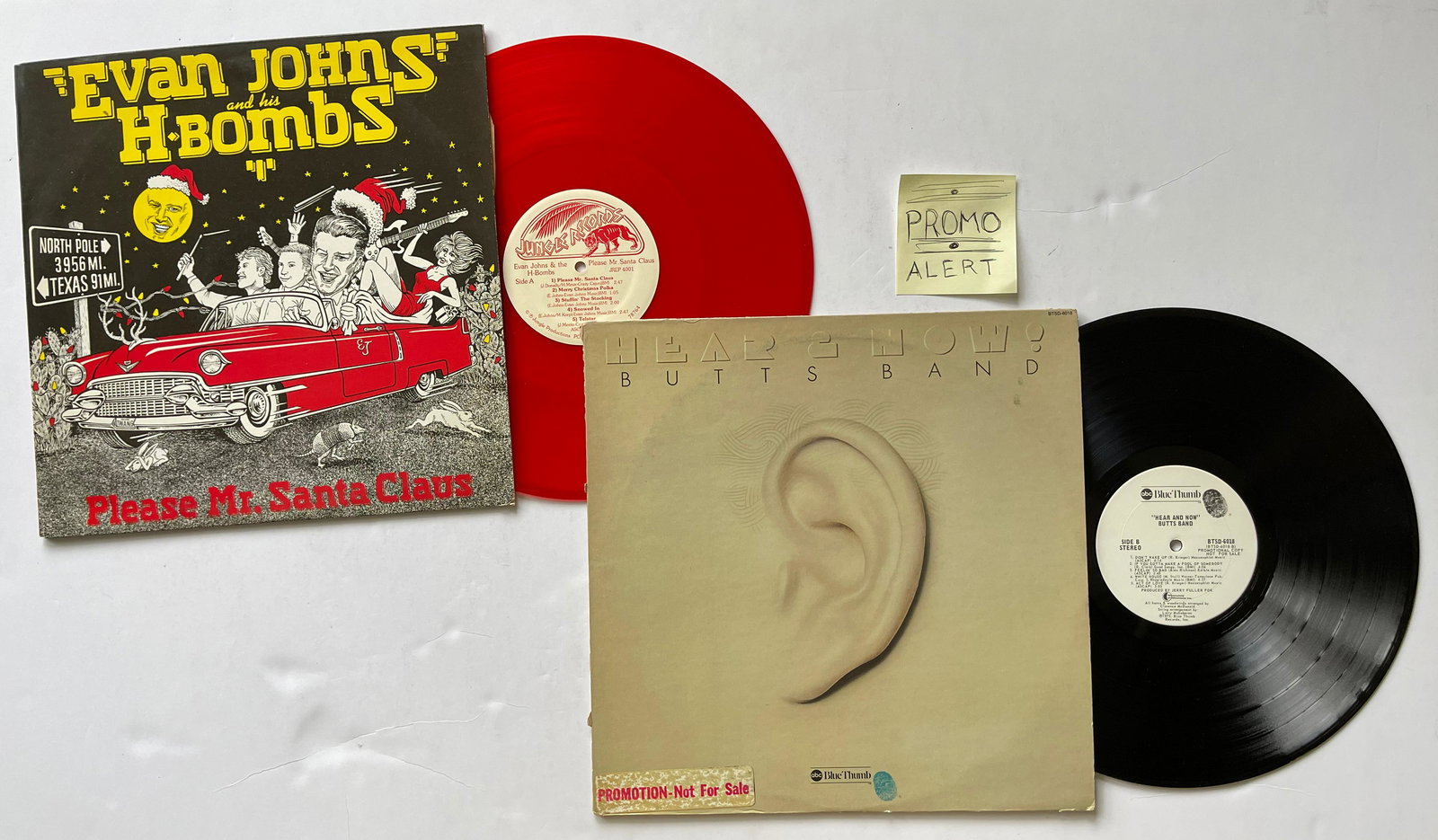 Evan Johns And His H-Bombs - Butts Band - PROMO: Evan Johns And His H-Bombs - Please Mr. Santa ClausLabel:Jungle Records (6) - JREP 4001Format:Vinyl, LP, RedTranslucentCountry:USReleased:1990Genre:RockStyle:Rock & Roll, Rockabilly - Butts Band - Hea