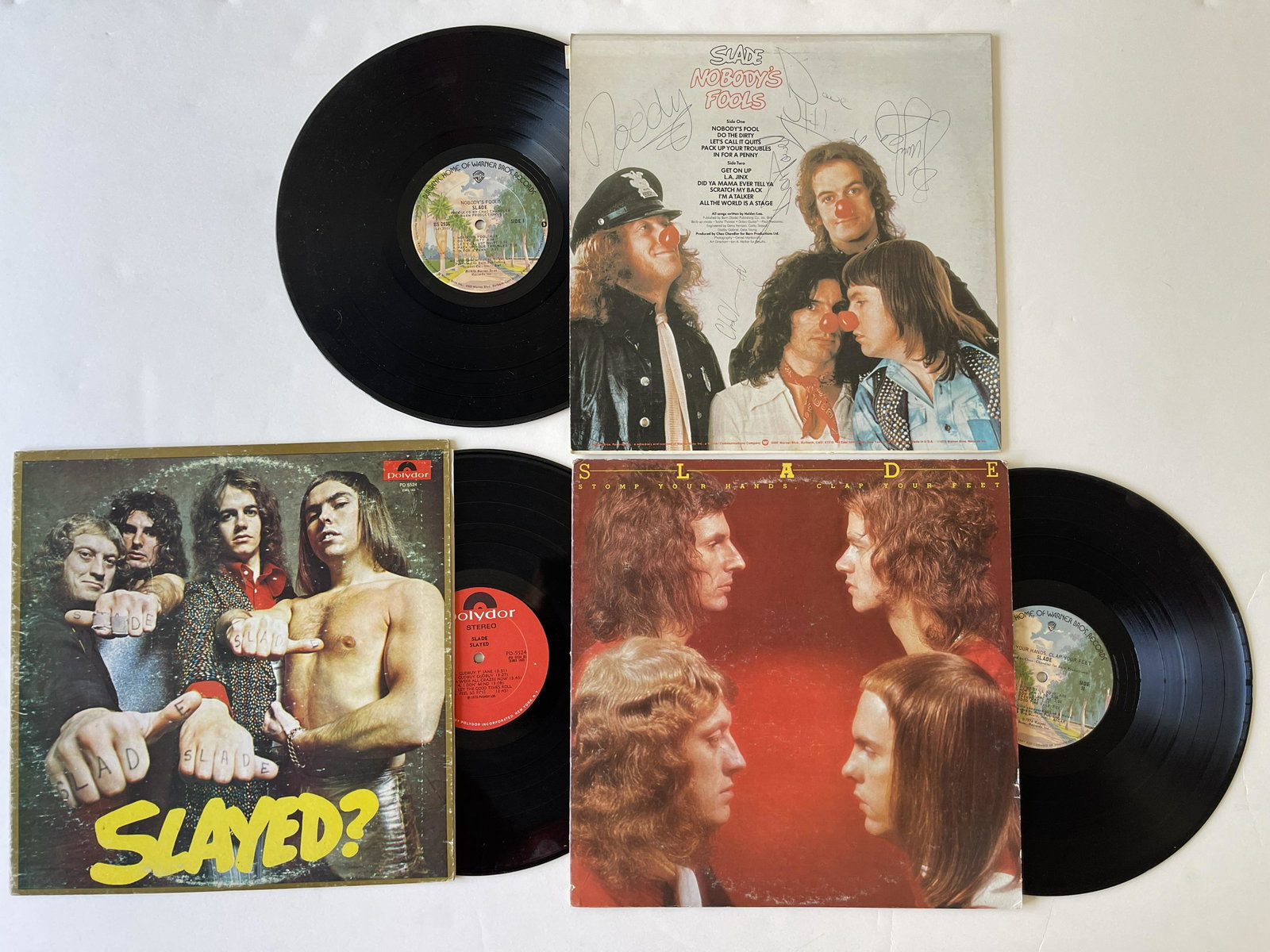 SIGNED ! ! ! Slade SET: SIGNED ! ! ! Slade - Nobodys Fools. Label:Warner Bros. Records - BS 2936. 1976. SIGNED BY ALL MEMBERS OF THE BAND. - AND - Slayed? Label: Polydor - PD 5524, Polydor - 2383 163. 1972 - AND - Stomp Your