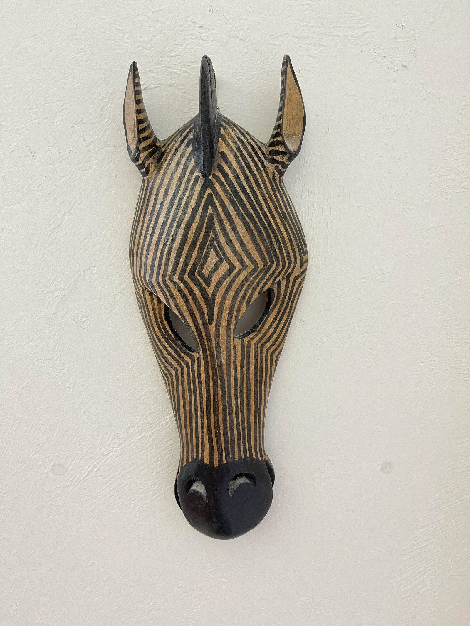 ZEBRA TRIBAL MASK: Wooden Tribal Zebra Hand Carved Mask from Kenya 14" tall In the case where you have won art that is framed, PashCo offers an unframing service. This can reduce your overall shipping cost. We will remo