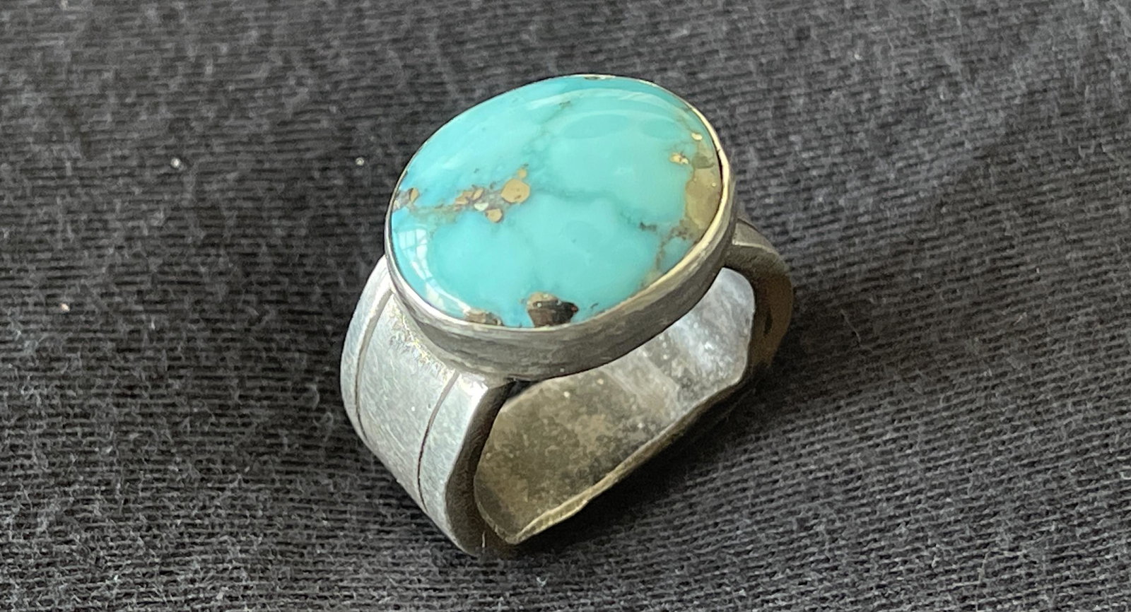 Campitos Turquoise Natural Stabilized: Campitos Turquoise Natural Stabilized (Estate Auction), Hand Forged, .925 Silver, Ron Singer, $150-200. Size US 5.75. Total Weight 13.3gm