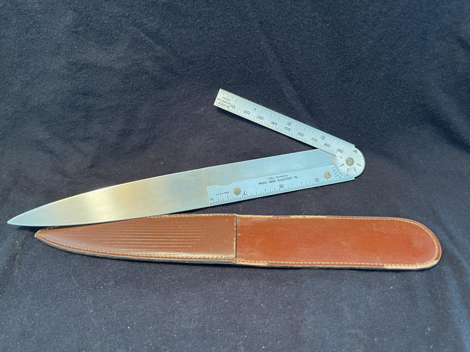 LETTER OPENER RULER: The Executive Desk Chum STAINLESS STEEL FOLDING RULER LETTER OPENER WITH LEATHER SHEATH MARKED REES BLOW PIPE MFG. CO. CAN FRANCISCO - LOS ANGELES.