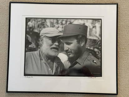 Signed Photo Con Hemingway 1960 Fidel Castro: An iconic image by Cuban photographer Osvaldo Salas captures a timeless moment between two legendsâ€”Ernest Hemingway and Fidel Castro - in May 1960, the only time the two ever met. While living