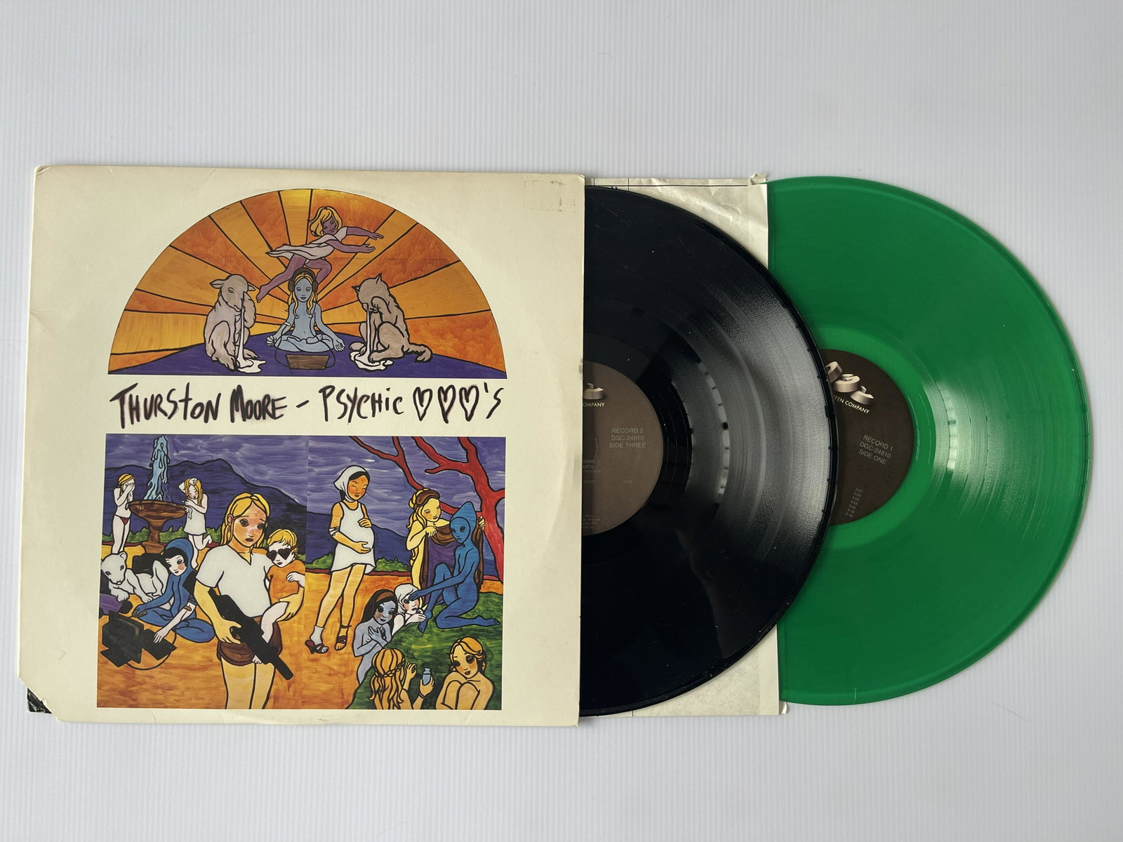 Thurston Moore - Psychic Hearts - GREEN / ETCHED: Thurston Moore - Psychic Hearts - GREEN AND ETCHED VERSION. Record One of this two record set is pressed on translucent green vinyl and Side Four has no music on it, instead it contains an etching of 