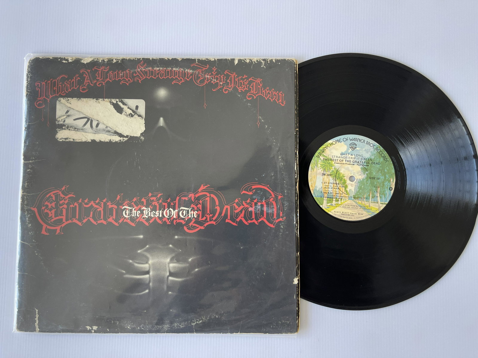 The Grateful Dead - What A Long Strange Trip Its Been: The Best Of The Grateful Dead. Warner Bros.: The Grateful Dead - What A Long Strange Trip Its Been: The Best Of The Grateful Dead. Warner Bros. Records - 2W 3091. Cover has poor edge wear.