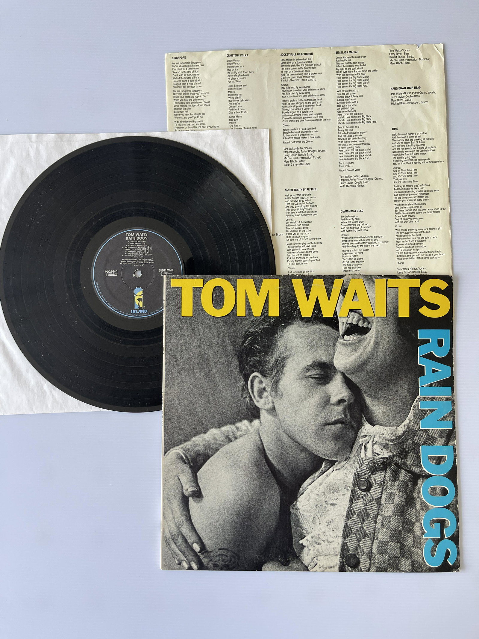 Tom Waits - Rain Dogs: Tom Waits - Rain Dogs. Island Records - 90299-1. Matrix / Runout (Label): ST-IL-855765-SP. Matrix / Runout (Runout): ST-IL 855766-B MASTERDISK 1-1. Includes printed paper inner sleeve with lyrics and 