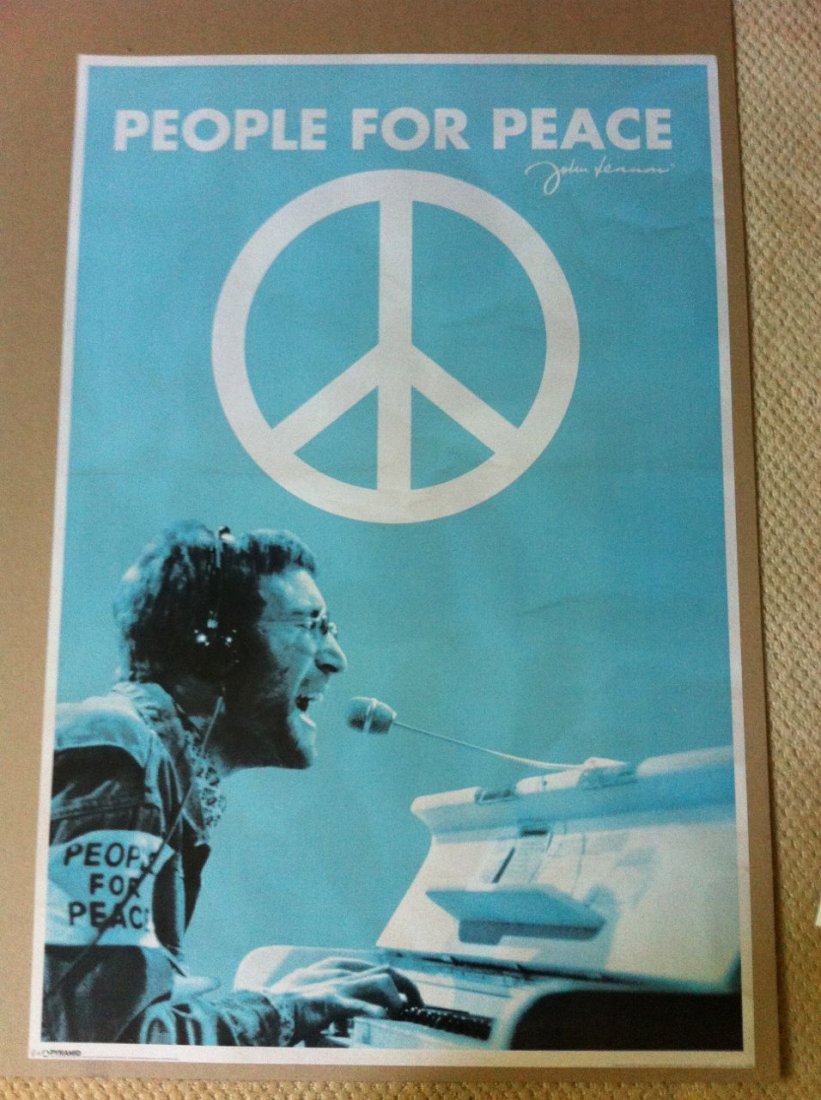 John Lennon People For Peace Poster: licensed from Yoko Ono. John Lennon (People for Peace) Music Poster Print. This poster shows John Lennon singing and playing the piano. At the top it says 'People for Peace' and has his signature and