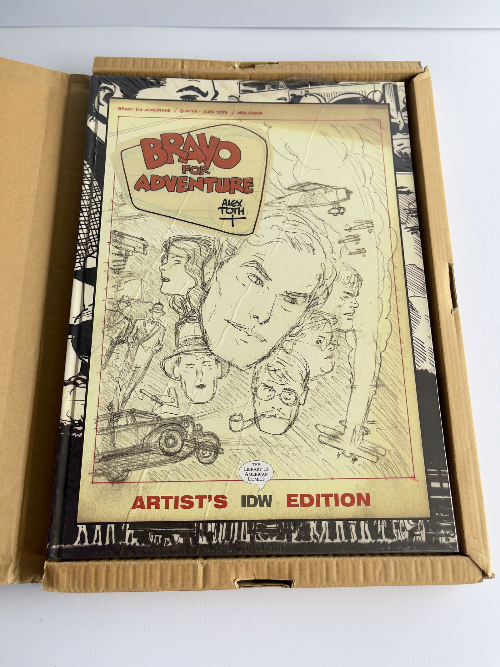 BRAVO FOR ADVENTURE SEALED HARDCOVER WITH BOX: BRAVO FOR ADVENTURE SEALED HARDCOVER WITH BOX. NEW - NEAR MINT. Alex Toth. Library Of American Comics. Artist's IDW Edition. Of every comics story Alex Toth ever drew, the only one that he kept the co