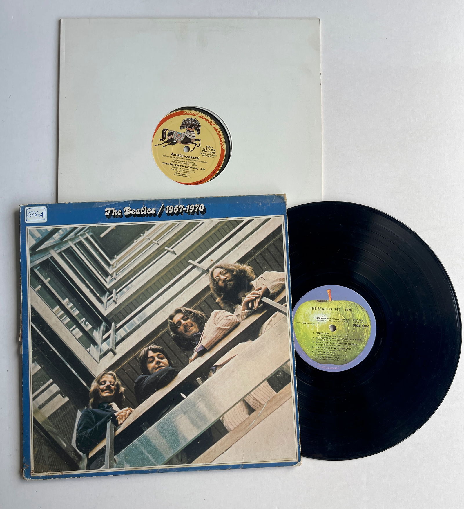 TWO BEATLES ALBUMS WITH PROMO: George Harrison - When We Was Fab PROMO ($25). The Beatles - 1967-1970 ($25).